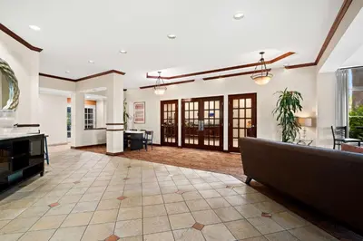 a living room with a couch and a table at Best Western Ontario Mills Mall in Ontario