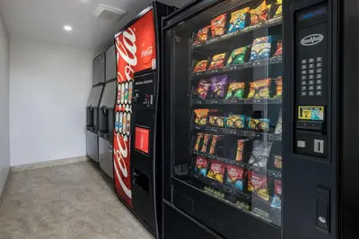 a vending machine filled with lots of soda and snacks at Best Western Corona Hotel & Suites in Corona