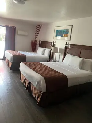 a hotel room with two beds in a room at Knights Inn Los Angeles Central / Convention Center Area in Los Angeles