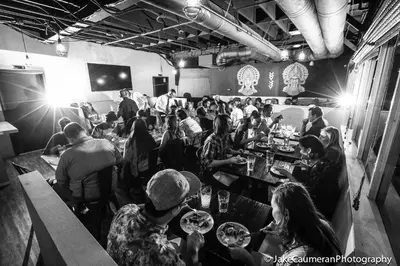 a group of people sitting at a table in a restaurant at Knights Inn Los Angeles Central / Convention Center Area in Los Angeles