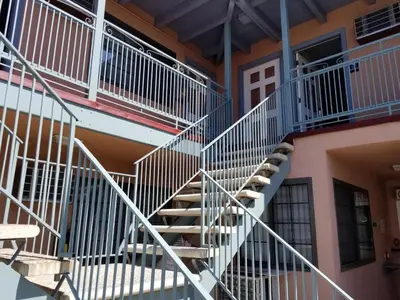 a metal spiral staircase in a building at Espana Motel in Norwalk