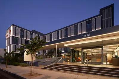 a building with a building with lights on at Hotel Mariposa in Los Angeles