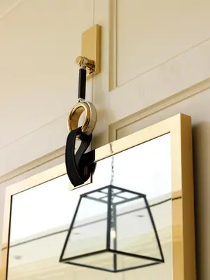 a glass lantern hanging on a door with a window at The London West Hollywood at Beverly Hills in Los Angeles