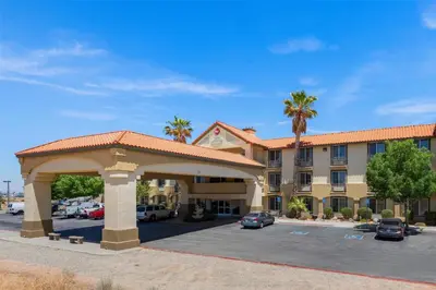 a parking lot in front of a hotel at Best Western Plus John Jay Inn & Suites in Palmdale