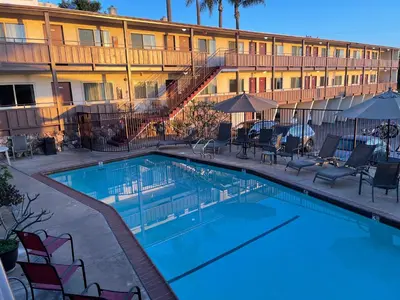 a swimming pool in front of a hotel at Seahorse Inn Manhattan Beach - LAX in Manhattan Beach