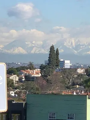 a view of a city with mountains in the background at Seahorse Inn Manhattan Beach - LAX in Manhattan Beach