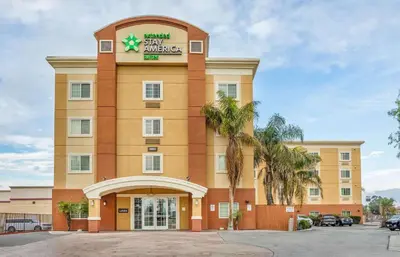 a large building with a sign on it at Extended Stay America Suites - Bakersfield - Chester Lane in Bakersfield
