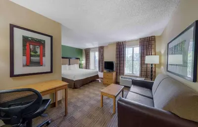 a hotel room with a bed and a couch at Extended Stay America Suites - Los Angeles - Glendale in Glendale