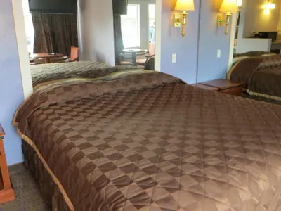 a bedroom with a large bed in a hotel room at Park Cienega Motel in Los Angeles