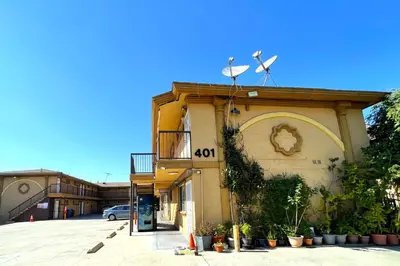a building with a clock on the side of it at Travel Inn Downtown LA in Los Angeles
