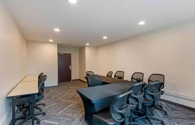 a conference room with a table and chairs at Extended Stay America Suites - Los Angeles - Chino Valley in Chino