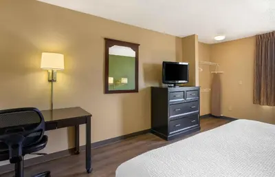 a hotel room with a bed and a desk with a television at Extended Stay America Suites - Los Angeles - Simi Valley in Santa Susana Knolls