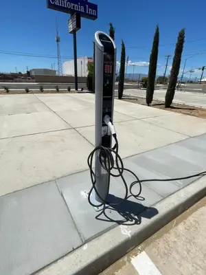 a parking meter on the side of a street at California Inn Hotel and Suites Adelanto US 395 in Adelanto