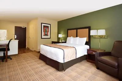 a hotel room with a bed and a desk and a chair at Extended Studio Hotel Suites - Los Angeles - San Dimas in San Dimas