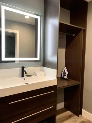 a bathroom with a sink and a mirror at Sakura Inn in Glendale