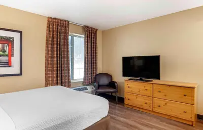 a bedroom with a bed and a flat screen tv at Extended Stay America Suites - Los Angeles - Monrovia in Monrovia