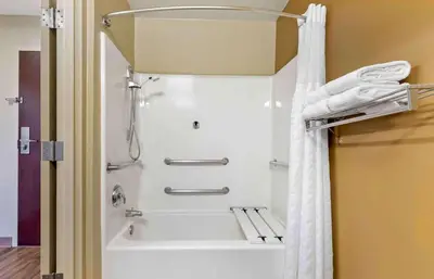 a shower in a bathroom with a white shower curtain at Extended Stay America Suites - Los Angeles - Monrovia in Monrovia