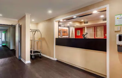 a hospital lobby with a counter and a mirror at Extended Stay America Suites - Los Angeles - Monrovia in Monrovia
