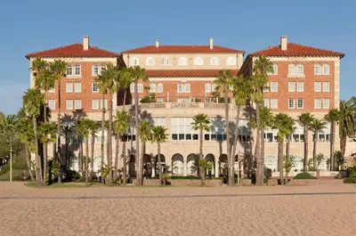 a large building with palm trees in front of it at Casa Del Mar in Los Angeles