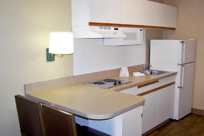 a small kitchen with a sink and a refrigerator at Extended Stay America Suites - Orange County - Cypress in Cypress