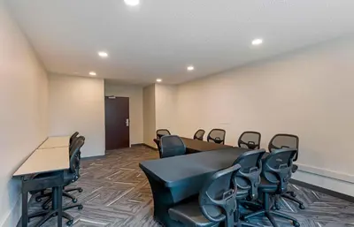 a conference room with a table and chairs at Extended Stay America Suites - Orange County - Cypress in Cypress