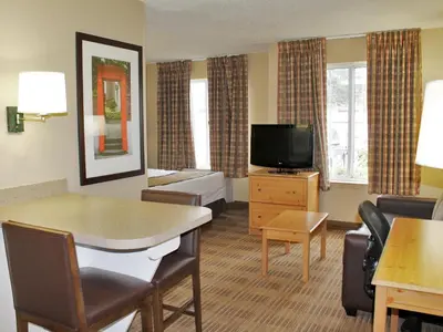 a hotel room with a living area with a television at Extended Stay America Suites - Los Angeles - Torrance - Del Amo Circle in Torrance
