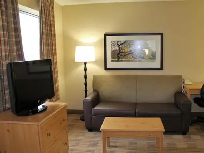 a living room with a couch and a tv at Extended Stay America Suites - Los Angeles - Torrance - Del Amo Circle in Torrance