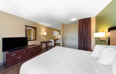 a hotel room with a bed and a flat screen tv at Extended Stay America Suites - Los Angeles - Burbank Airport in Burbank