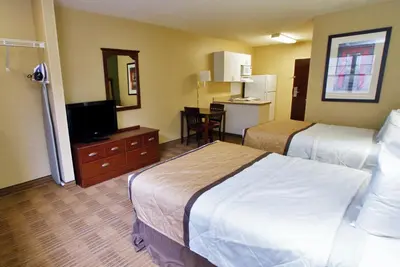 a hotel room with two beds and a flat screen tv at Extended Stay America Suites - Los Angeles - Burbank Airport in Burbank