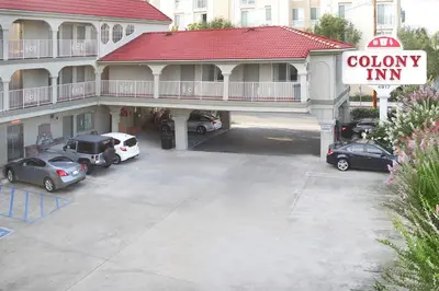 an empty parking lot in front of a colley inn at Colony Inn in North Hollywood