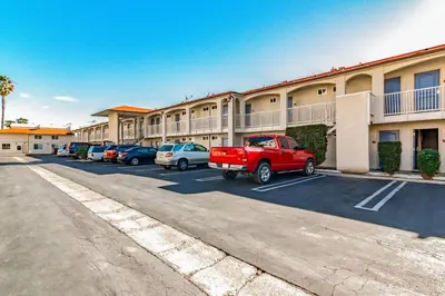 a parking lot in front of a hotel at Motel 6-Anaheim, CA in Anaheim