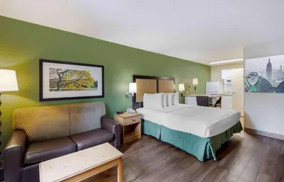 a hotel room with a bed and a couch at Extended Stay America Suites - Los Angeles - LAX Airport - El Segundo in El Segundo