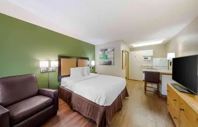a hotel room with a bed and a flat screen tv at Extended Stay America Suites - Los Angeles - LAX Airport - El Segundo in El Segundo
