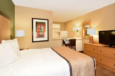 a hotel room with a bed and a flat screen tv at Extended Stay America Suites - Los Angeles - LAX Airport - El Segundo in El Segundo