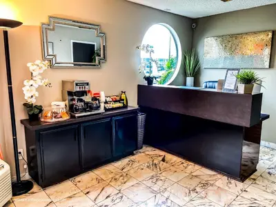 a barber shop with a counter and a mirror at Vantage Point Inn - Woodland Hills in Woodland Hills