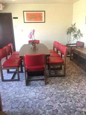 a conference room with a table and red chairs at Grand Inn\u8ca1\u795e\u5ba2\u68e7 in Monterey Park