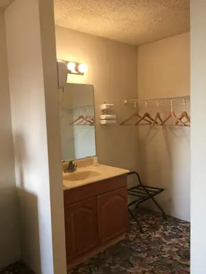 a bathroom with a sink and a mirror at Grand Inn\u8ca1\u795e\u5ba2\u68e7 in Monterey Park