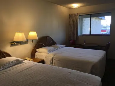 a hotel room with two beds and a window at Grand Inn\u8ca1\u795e\u5ba2\u68e7 in Monterey Park