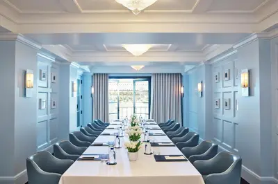 a conference room with a long table and chairs at The Maybourne Beverly Hills, Maybourne in Los Angeles