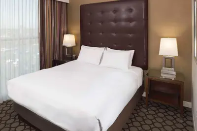 a large white bed in a hotel room at Hyatt Regency Orange County in Anaheim