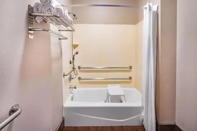 a bathroom with a bath tub and a toilet at Super 8 by Wyndham North Hollywood in North Hollywood