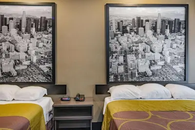 a hotel room with two beds and a city at Super 8 by Wyndham North Hollywood in North Hollywood