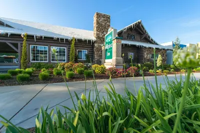 a hotel with a sign in front of a building at Alpine Inn near Convention Center and the Park in Anaheim