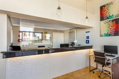 a bar in a office with a desk and chairs at Best Western Heritage Inn in Bakersfield