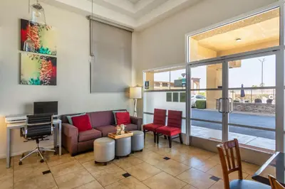 a living room with a couch and a table at Best Western Heritage Inn in Bakersfield