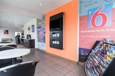 a fast food restaurant with an orange wall at Motel 6-Long Beach, CA - International City in Long Beach
