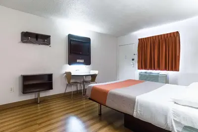a hotel room with a bed and a television at Motel 6-Long Beach, CA - International City in Long Beach