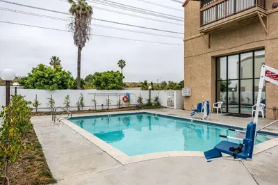 a swimming pool in the backyard of a house at Motel 6-Gardena, CA - South in Gardena