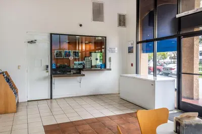 a kitchen with a counter and a window in a room at Motel 6-Gardena, CA - South in Gardena