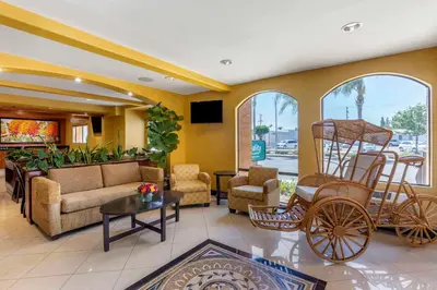 a living room with a couch and chairs at Quality Inn & Suites Westminster Seal Beach in Westminster